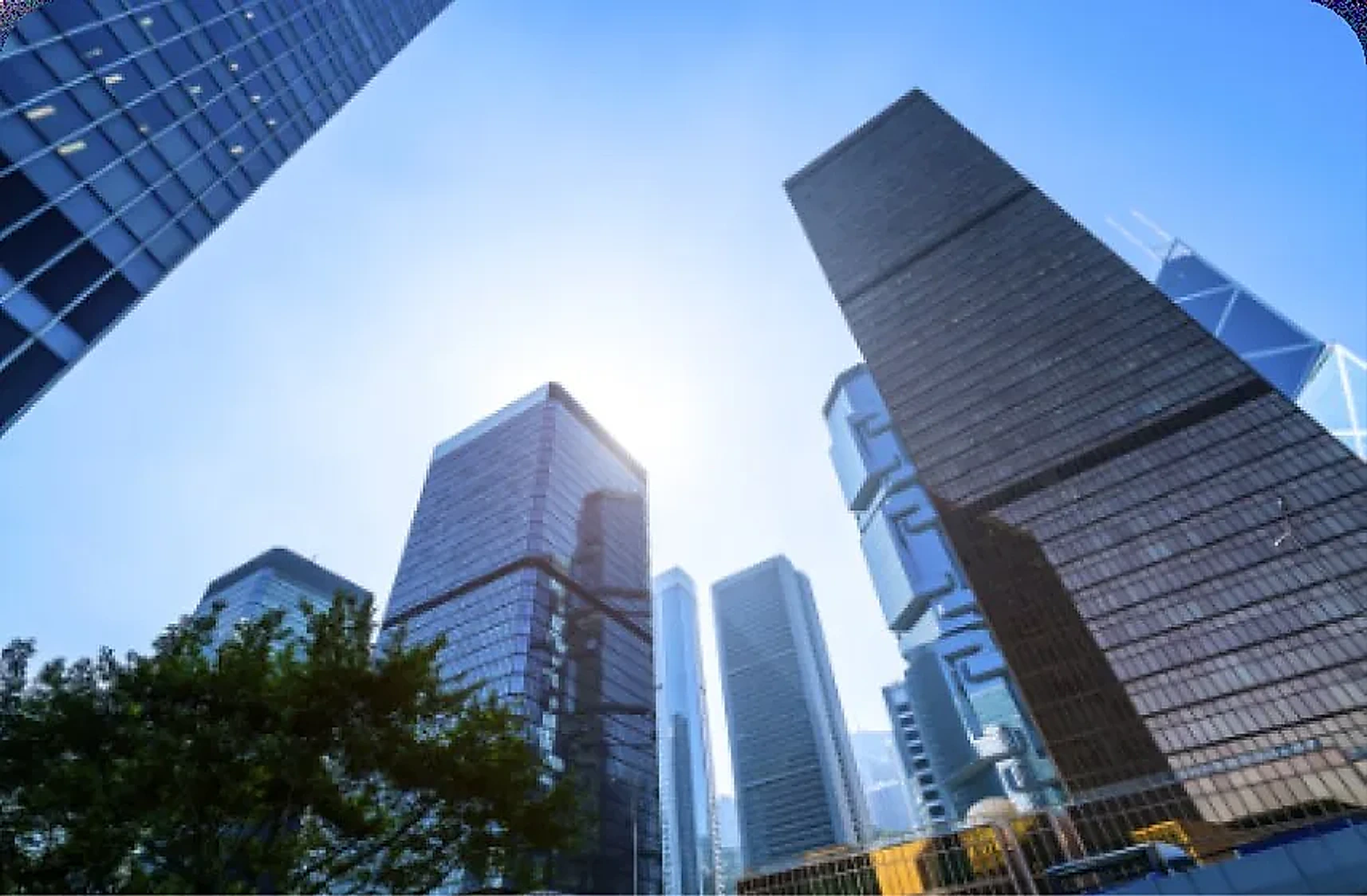Skyscrapers seen from below against a blue sky