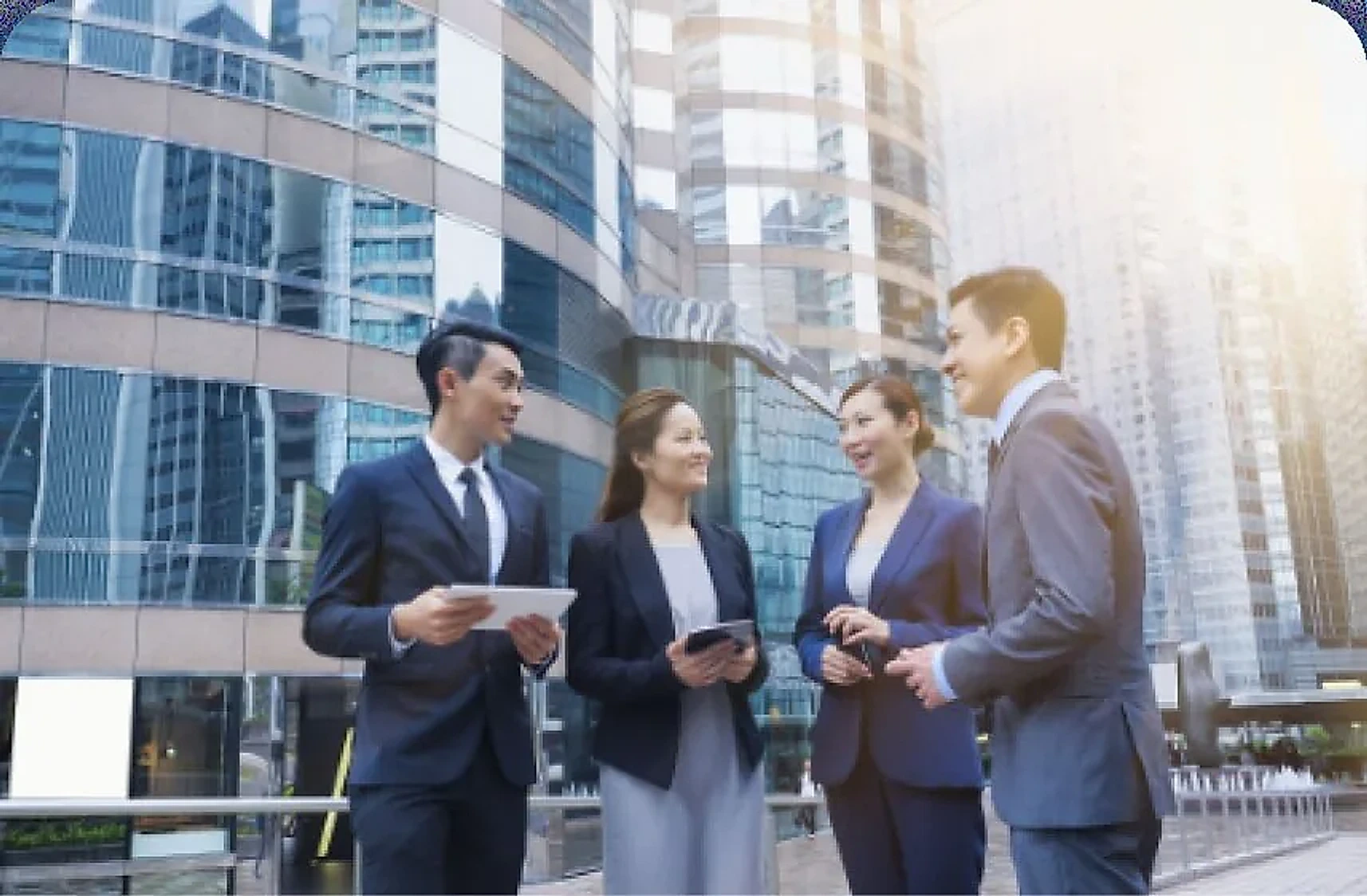 Business team talking in front of an office tower
