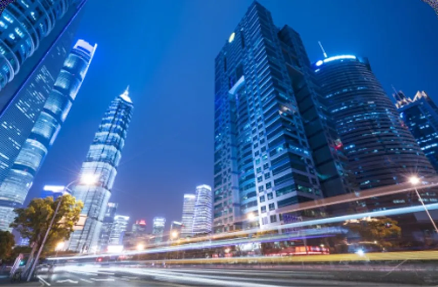 Night city skyline with towers and light trails